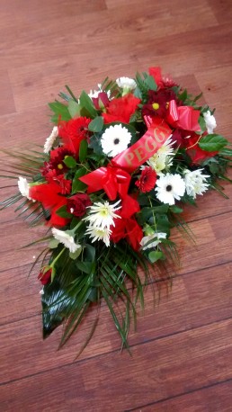 Red and white funeral arrangement